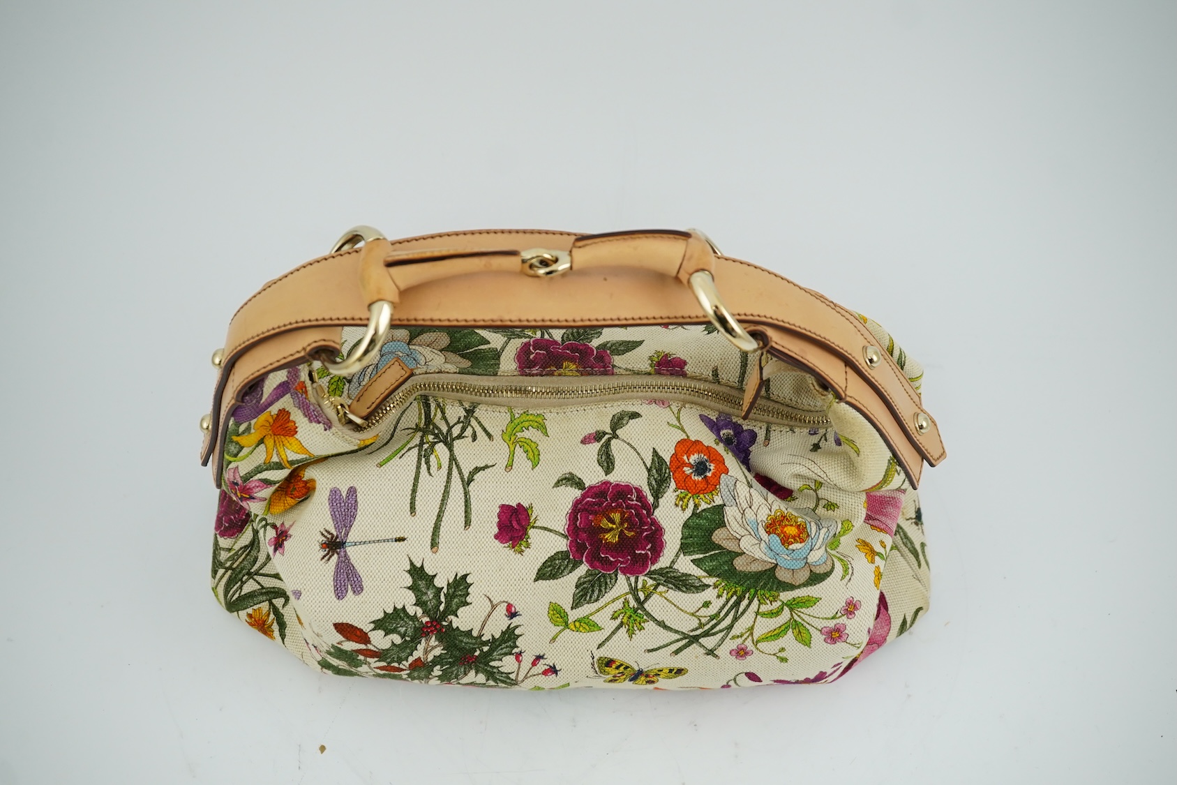 A Gucci flora canvas horse-bit hobo bag with dust bag